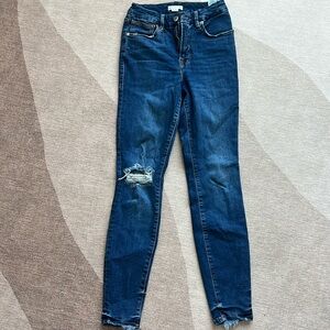 Dark wash Good American skinny jean (distressed on the right knee)
